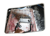 Rug cleaning service technician washing an Oriental rug in El Paso